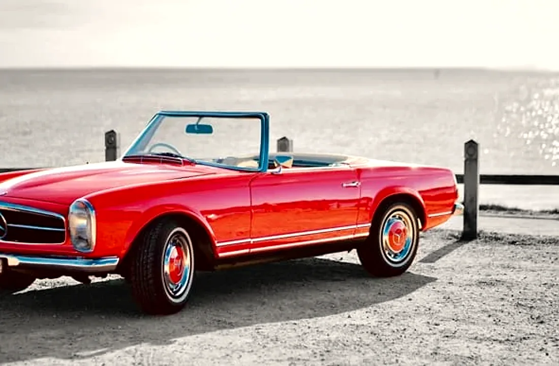 A red Mercedes-Benz 280 SL Pagoda serviced by Atelier Automotive